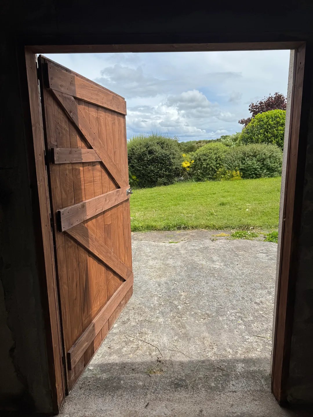 A welcoming open door looking out onto the yard
